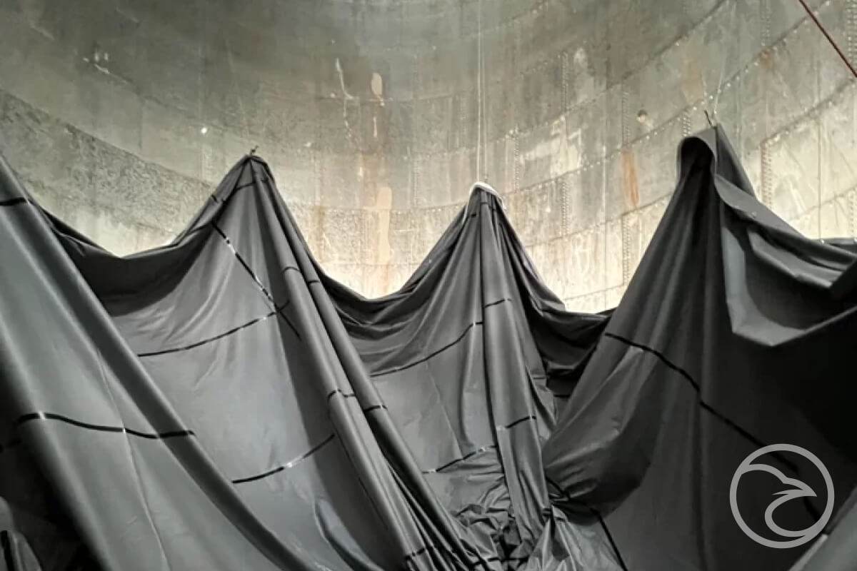Servicing Industrial & Commercial Water - Black cloth draped over wall.