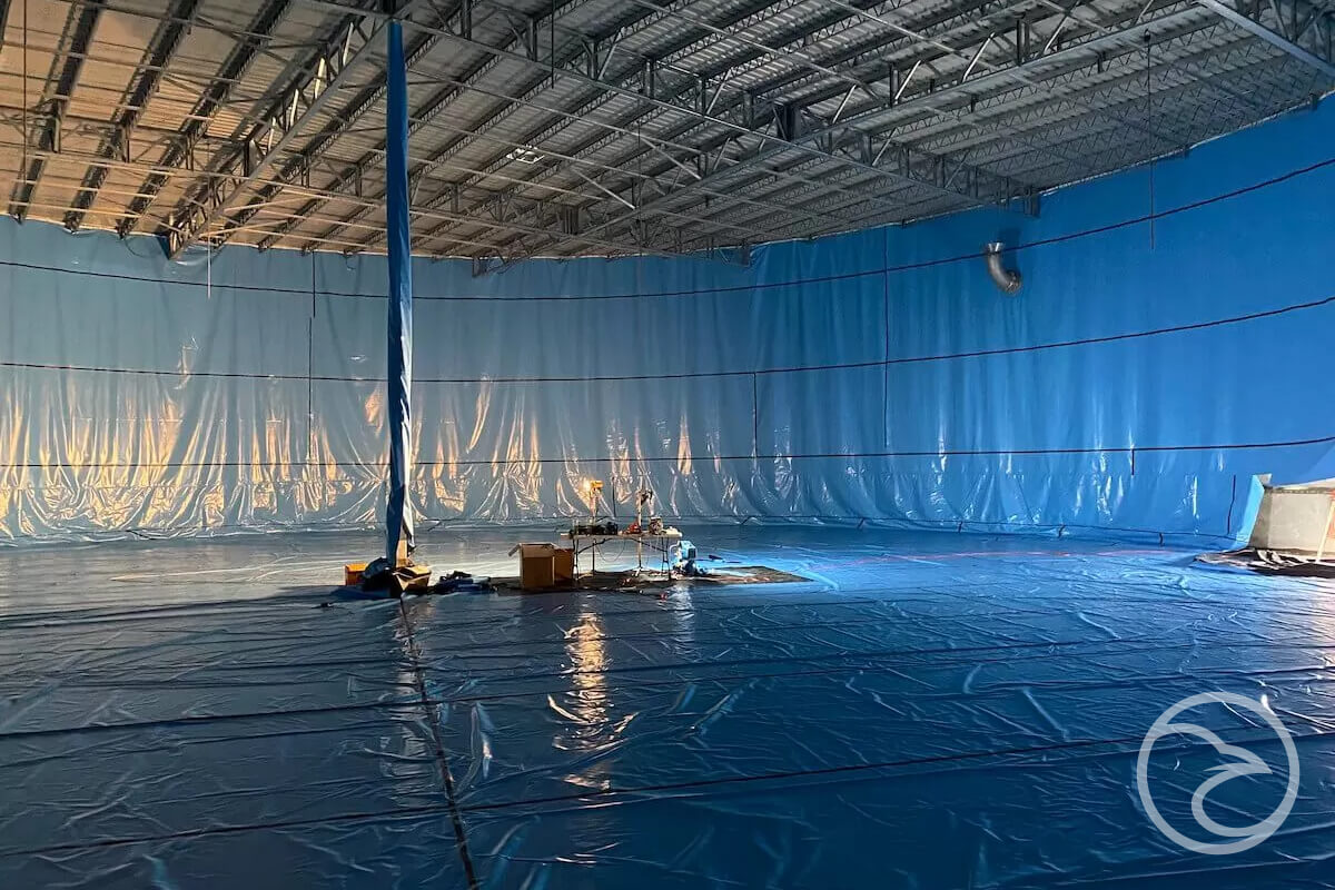 Waterproofing Membrane? - A spacious room concealed by a blue tarp.