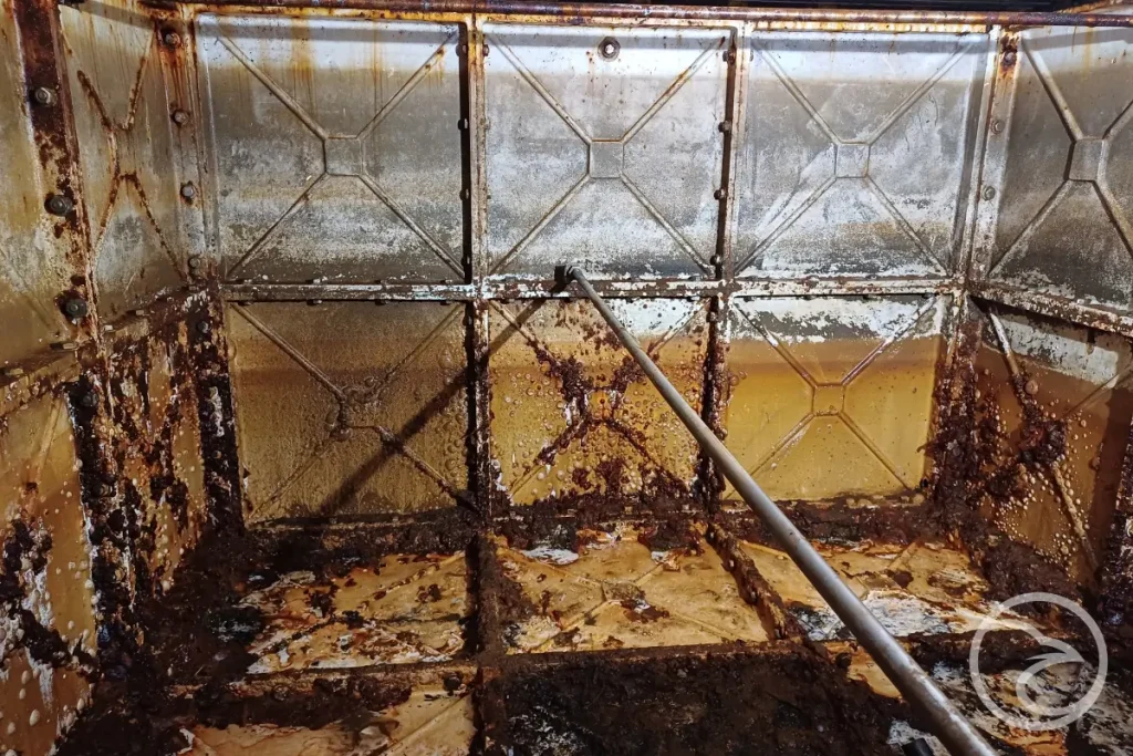 mic corrosion in steel water tanks with visible corrosion patterns