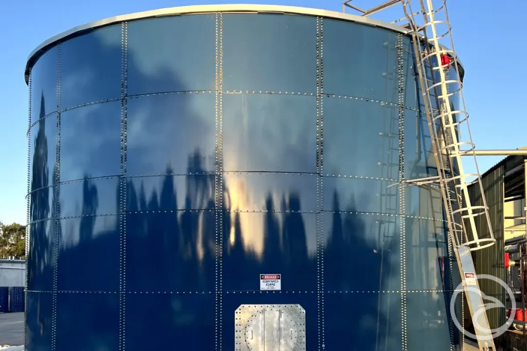 Glass fused water tank with access ladder and safety railing