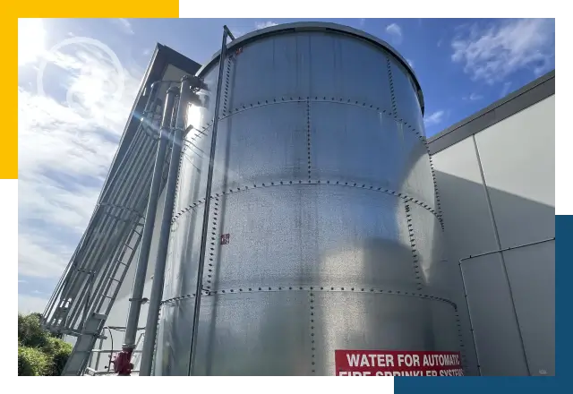 Fire water storage tank integrated with building fire suppression system