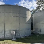 Team performing fire tank corrosion testing and repairs