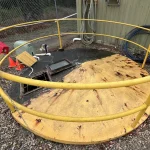 worker inspecting a confined space environment