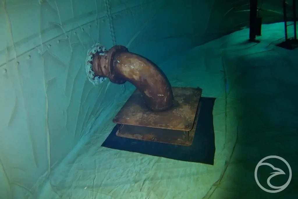 Technician monitoring live tank inspection footage